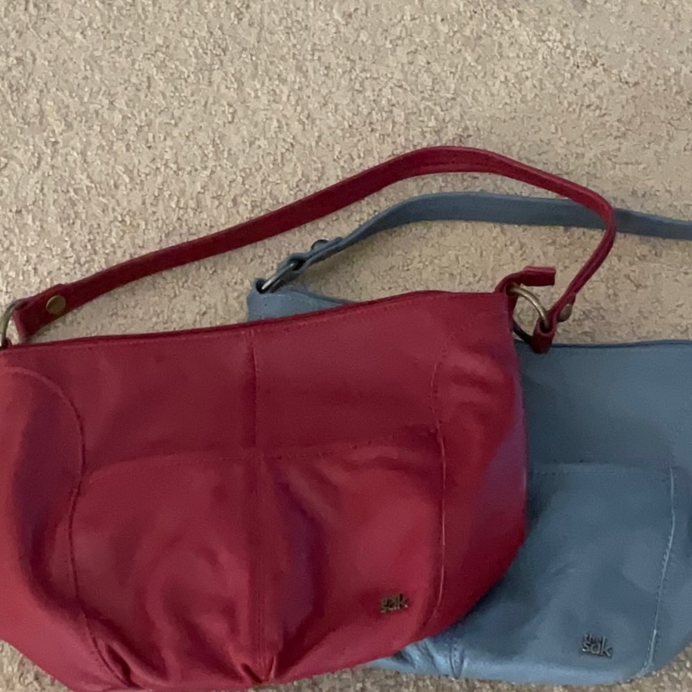 Two The Sax purses spent $100 each asking $100 for both purses